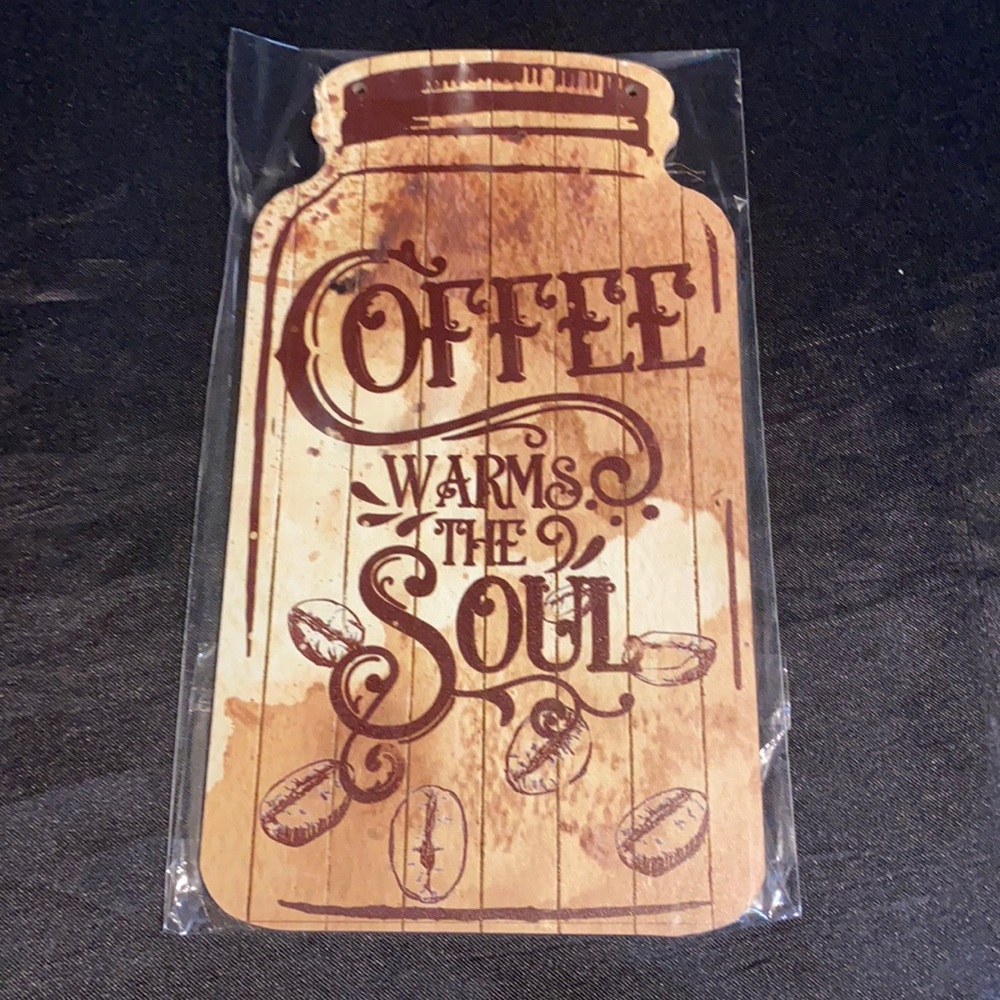 Wooden mason jar shaped sign; coffee warms the soul. Includes twine string.